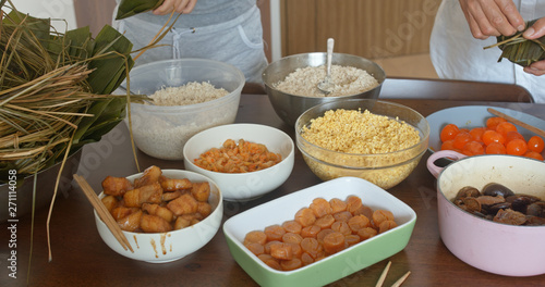Family member making rice dumpling at home together