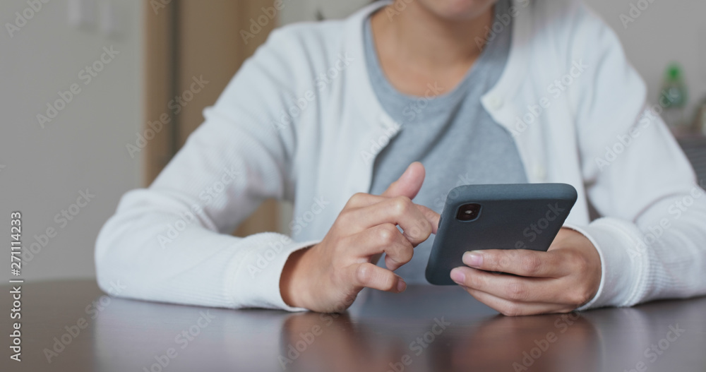Woman use of smart phone at home Woman use of smart phone at home