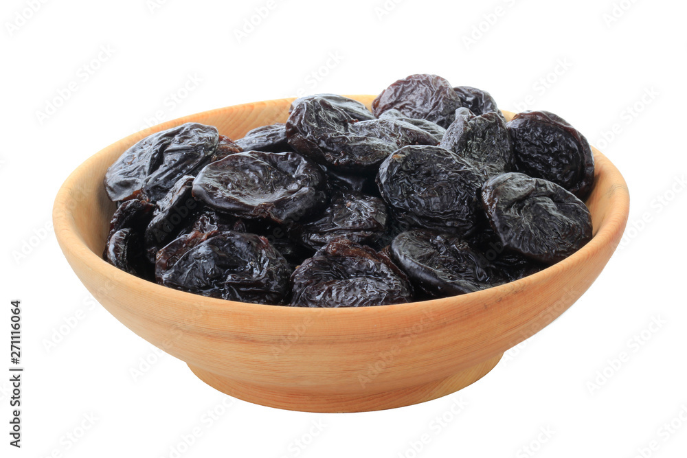 dried plums in wooden cup isolated on white background dried plums in wooden cup isolated on white background