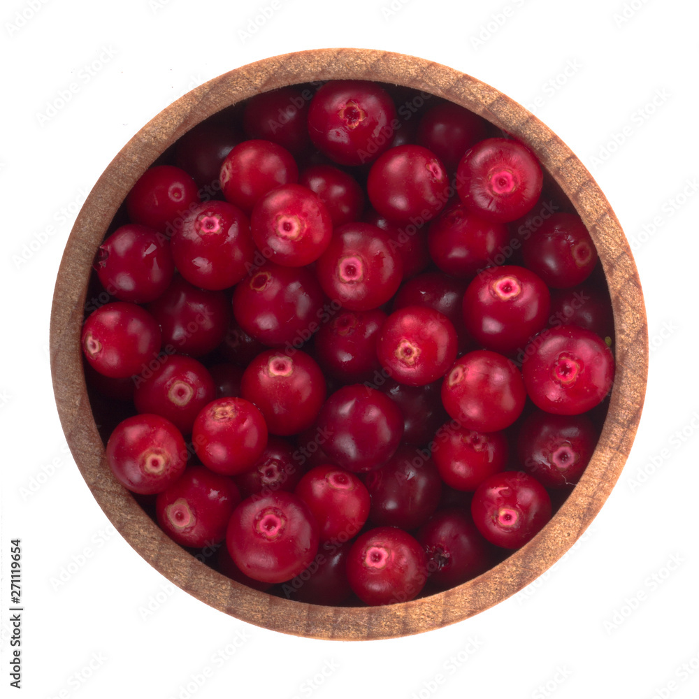 fresh red cowberry in wooden cup isolated on white background. top view fresh red cowberry in wooden cup isolated on white background. top view
