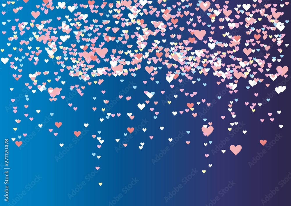 multicolored sequins serpentine in the form of heart piled on a blue background