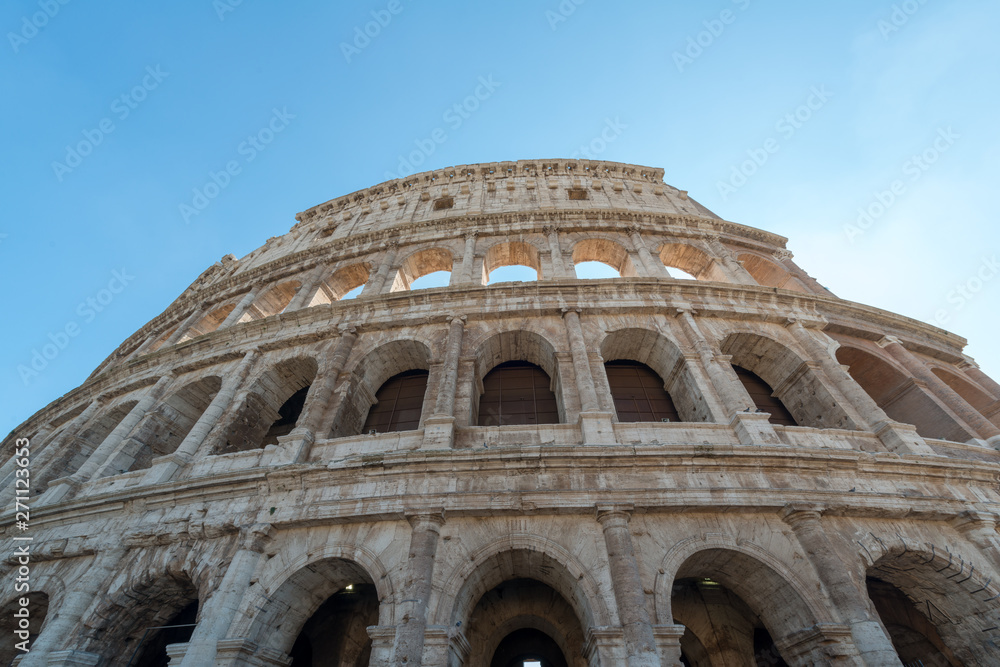 Close up view from below of Rome Colosseum in Rome, Italy. The Colosseum was built in the time of Ancient Rome in the city center. It is one of Rome most popular tourist attractions in Italy.