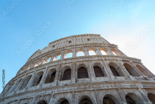 Close up view from below of Rome Colosseum in Rome  Italy. The Colosseum was built in the time of Ancient Rome in the city center. It is one of Rome most popular tourist attractions in Italy.