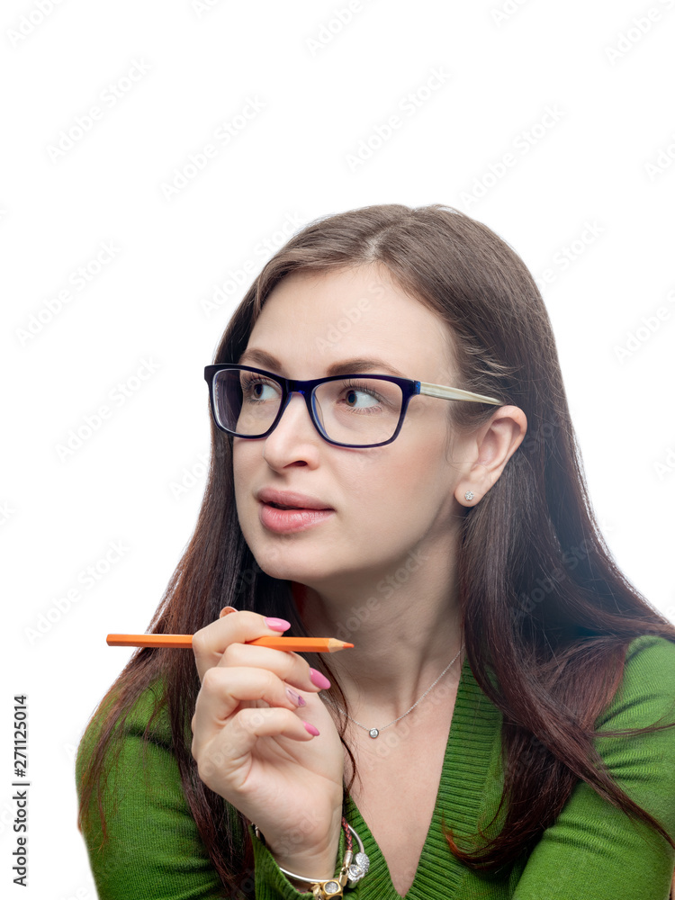 Young woman portrait. Long hair brunette female model head shot with orange pencil. Studio image isolated on white. Young woman portrait. Long hair brunette female model head shot with orange pencil. Studio image isolated on white.