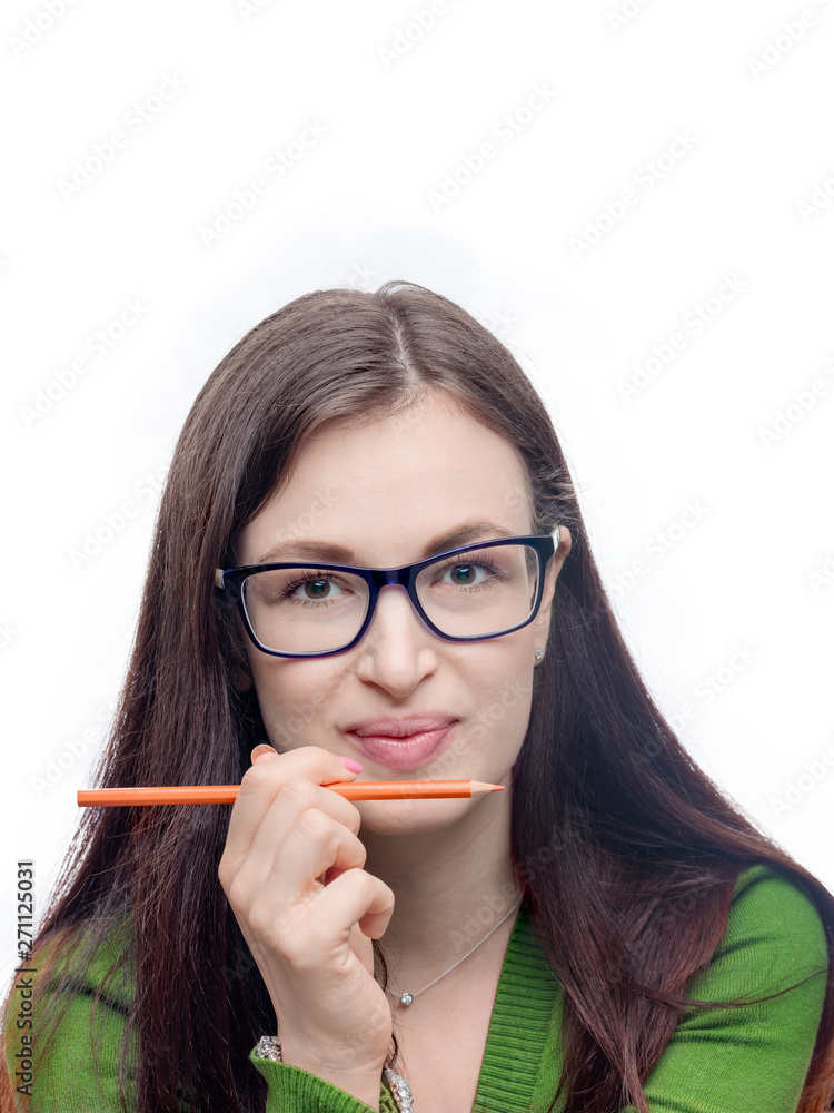 Young woman portrait. Long hair brunette female model head shot with orange pencil. Studio image isolated on white. Young woman portrait. Long hair brunette female model head shot with orange pencil. Studio image isolated on white.