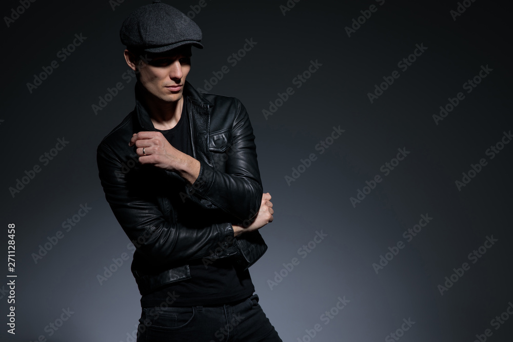 Mystified young man curiously looking to the side Mystified young man curiously looking to the side