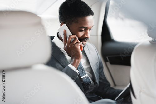 Business Trip. Man Talking On Phone And Discussing Work © Prostock-studio