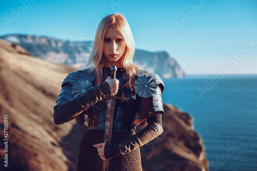 The cute female warrior attacking with sword