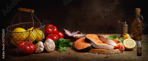 fresh salmon steaks with ingredients for cooking