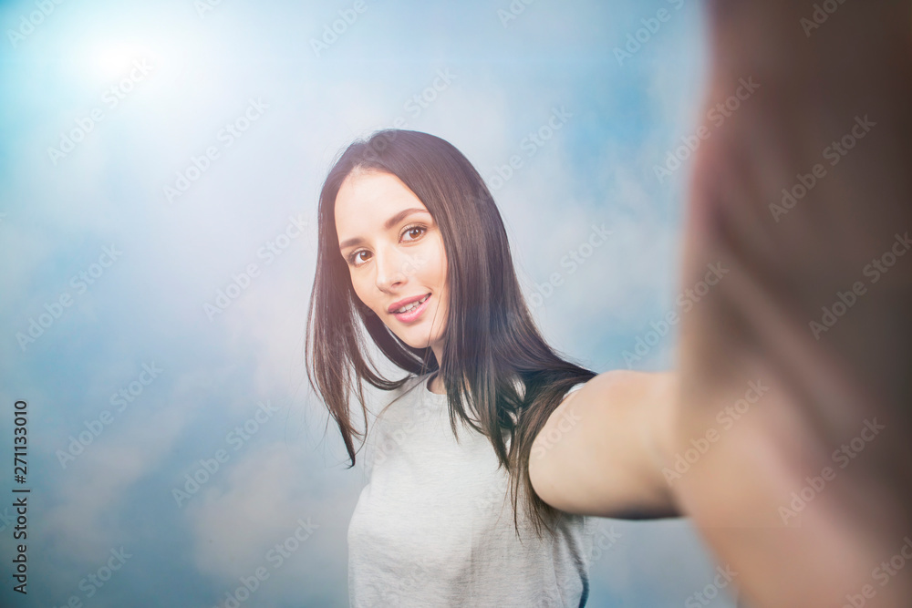 happy young woman make selfie by camera