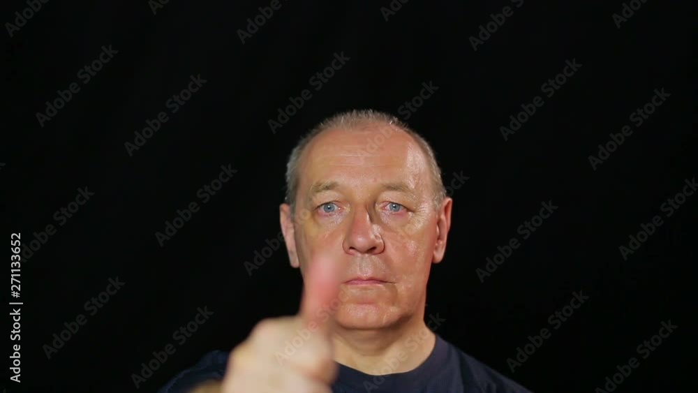 A man does exercises for the eyes holding and distancing his finger.