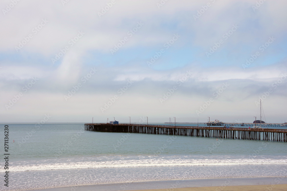 Ocean beach in California with a pier on a foggy day in May