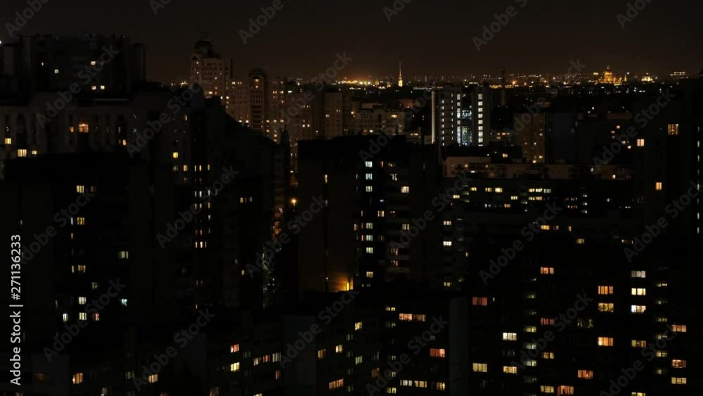 View of the night multi-storey houses. Lots of lights in the windows. Dormitory area. View of the night multi-storey houses. Lots of lights in the windows. Dormitory area.