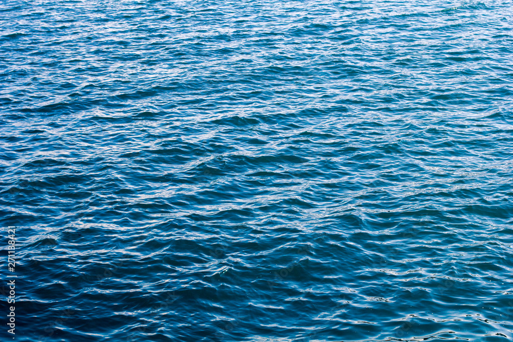 Blue sea surface with waves. Bright and contrasting sea concept. Blue sea surface with waves. Bright and contrasting sea concept.
