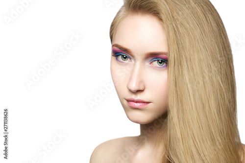 Portrait of a beautiful young blond girl with long hair and stylish pastel make-up. Spring image. Natural beauty