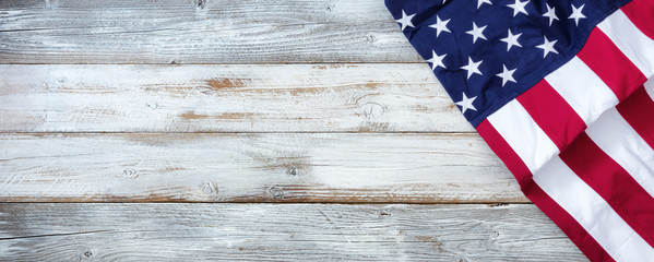 United States flag of America on white rustic wooden background with plenty of copy space