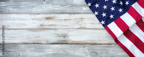 United States flag of America on white rustic wooden background with plenty of copy space