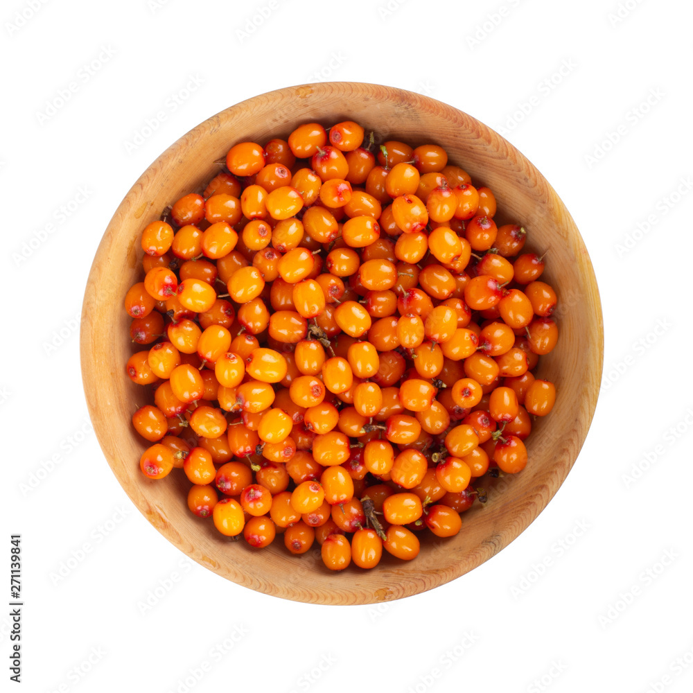 heap of sea buckthorn in wooden plate isolated. top view heap of sea buckthorn in wooden plate isolated. top view