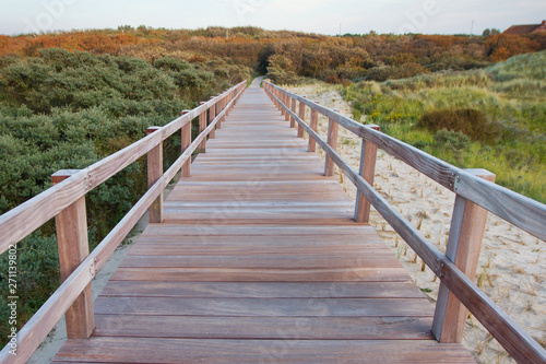 Fototapeta Naklejka Na Ścianę i Meble -  Wooden footbridge on a beach in West Flanders, Belgium