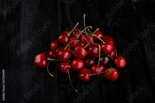 heap of cherry on wooden background