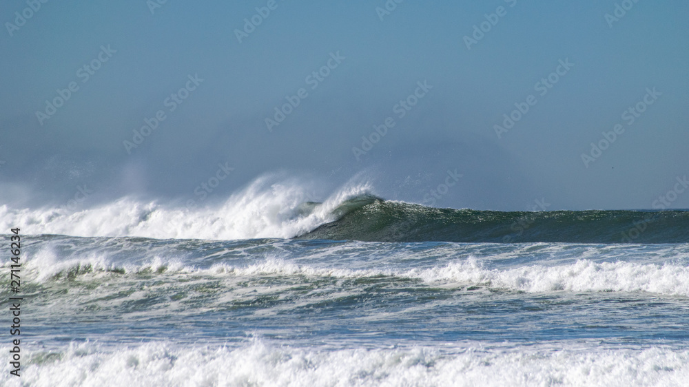 Atlantic ocean waves breaking onto beach in Agadir, Morocco