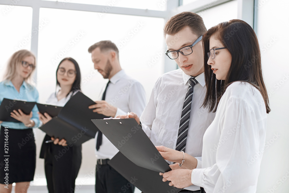 group of business people discussing business documents group of business people discussing business documents