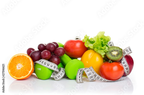 fitness equipment and healthy food isolated on white. apple  pepper  grapes  kiwi  orange  dumbbells and measuring tape.
