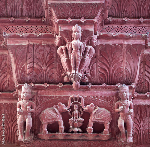 Ancient bas-relief of Colonial Rulers on the outer wall of Rampuria Haveli in Bikaner, Rajasthan, India photo