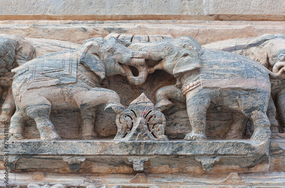 Bas-relief with Elephants at famous ancient Jagdish Temple in Udaipur, Rajasthan, India
