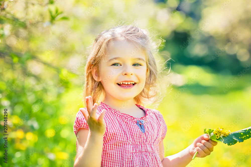 Happy little girl playing in sunny park Happy little girl playing in sunny park