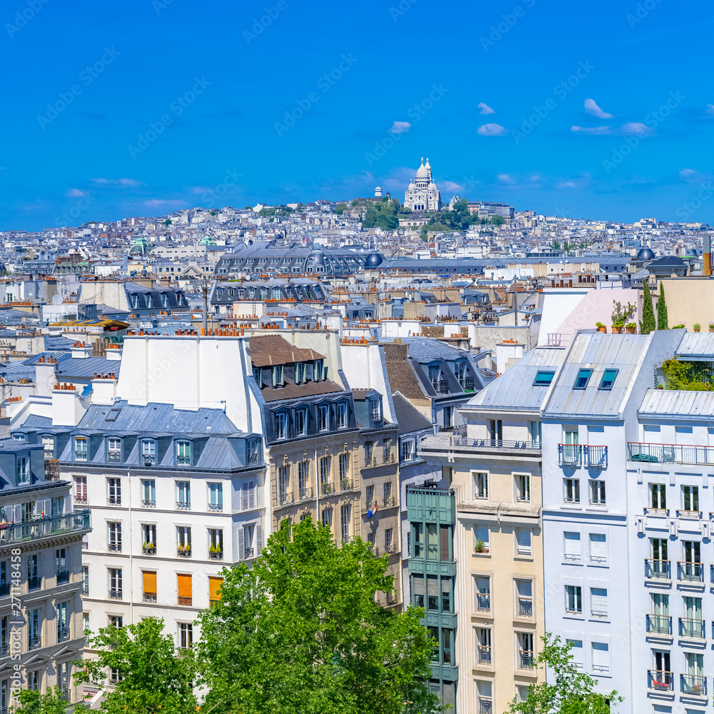     Paris, typical roofs in the Marais, aerial view with the Sacre-Coeur basilica 