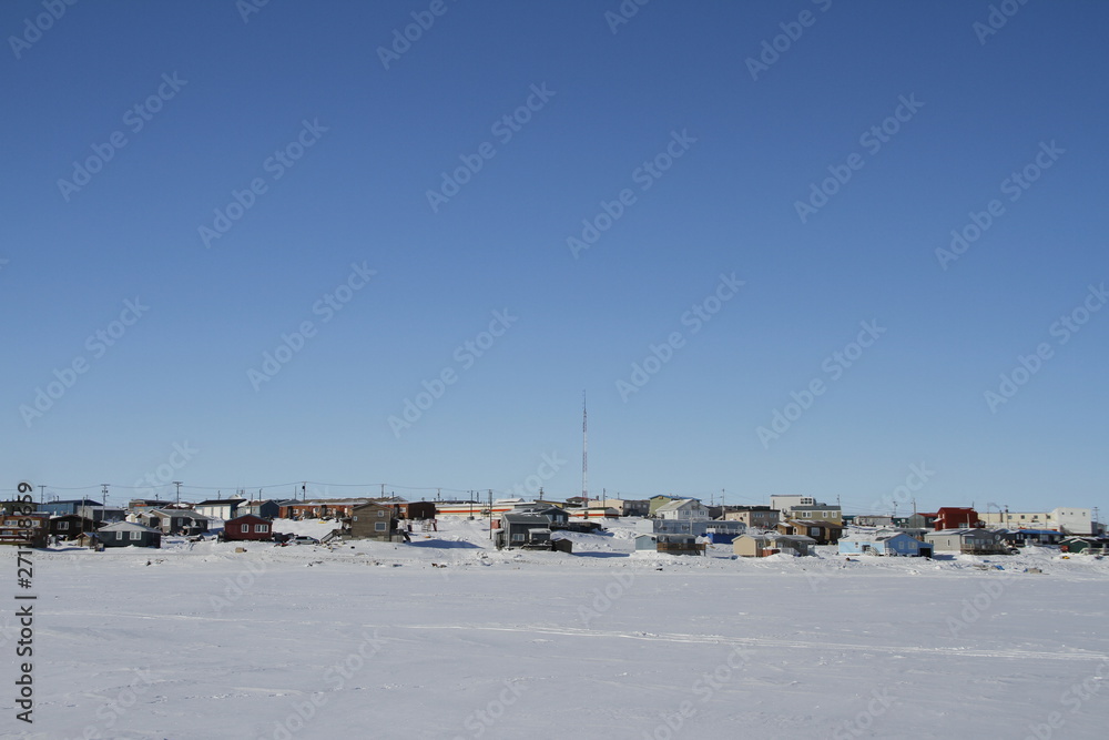 View of Cambridge Bay, Nunavut, a northern arctic community in Canada, during a sunny winter day