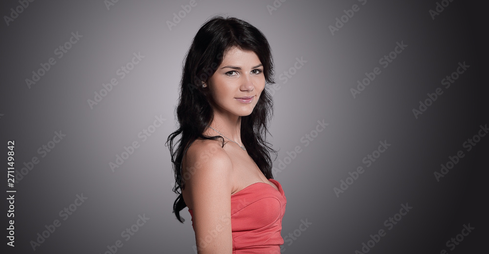 side view.beautiful young woman in a red dress. isolated on bla side view.beautiful young woman in a red dress. isolated on bla