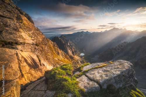 Mountains Landscape with Rock and Grass in Foreground at Sunrise. Bielovodska Valley as seen from Sedlo Vaha in High Tatras, Slovakia