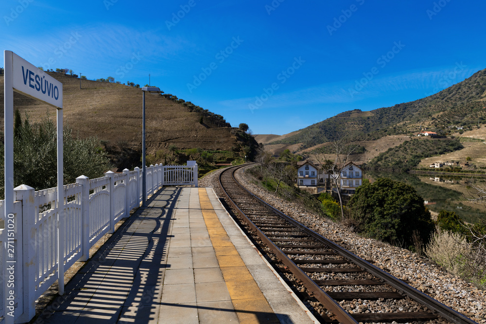 View of the iconic Quinta do Vesuvio with the Douro River and the train tracks in the Douro Valley; Concept for travel in Portugal