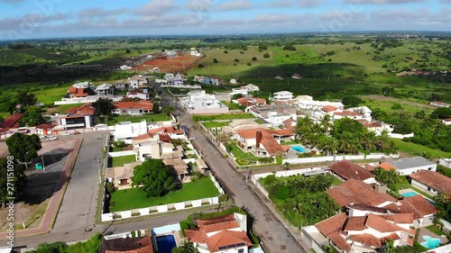 Panoramic Aerial drone view of Cruz das Almas, Bahia, Brazil. Show houses, small buildings in the neighborhood, and green environnement.   photo