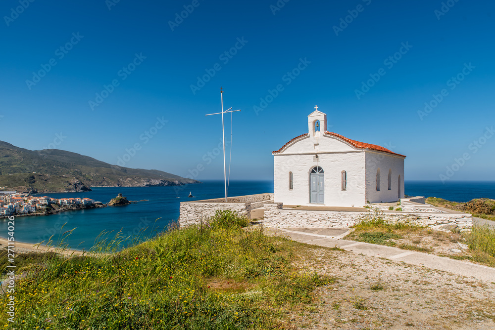 An old orthodox church in a hill next to chora of Andros, Cyclades, Greece