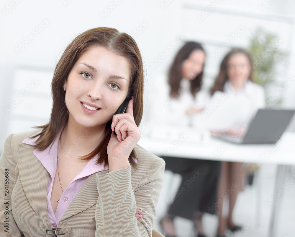 young employee on the phone in the office young employee on the phone in the office