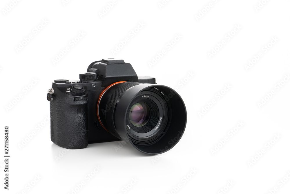 Mirrorless digital camera on pure white background with lens attached Mirrorless digital camera on pure white background with lens attached