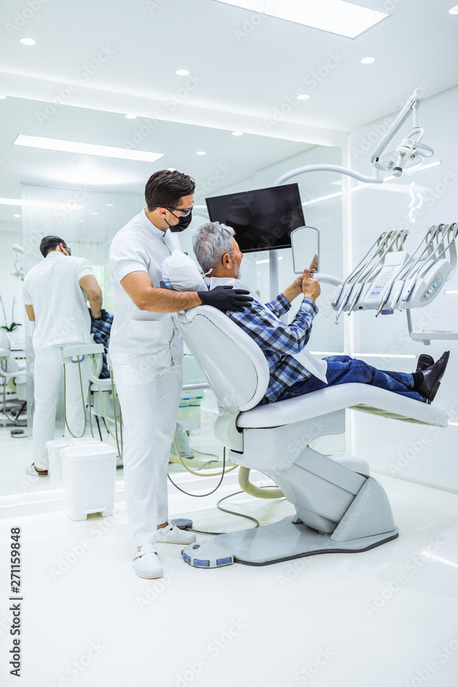 Senior man having dental treatment at dentist's office. Senior man having dental treatment at dentist's office.