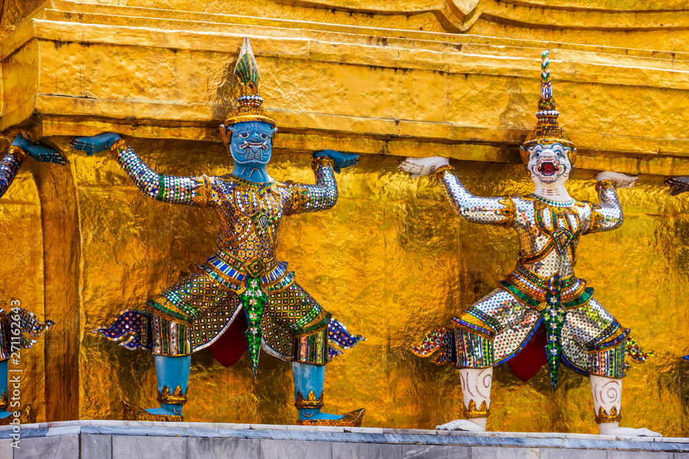 Giant statues at the base of Gold pagoda in Wat Pra Kaew in The Grand Palace