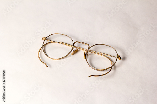 A pair of Antique Eyeglasses on a white background.