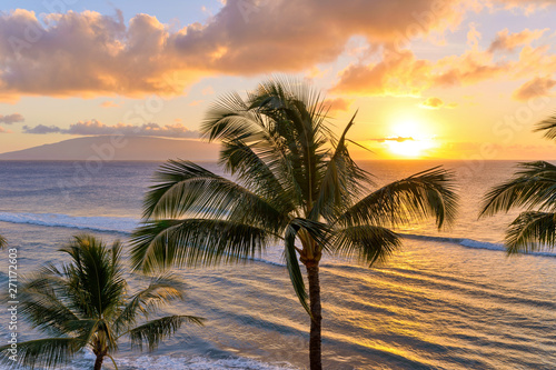 Sunset Maui - A colorful sunset at north-west coast of Maui, with Lanai island in the background. Maui, Hawaii, USA.