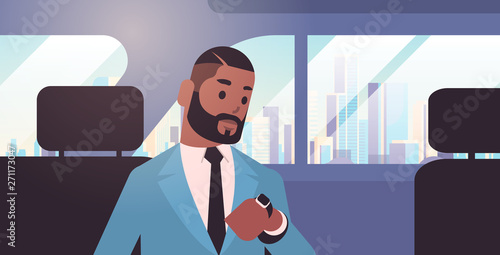 businessman looking at clock checking time african american passenger sitting on back seat in taxi cab city transportation service concept flat portrait horizontal