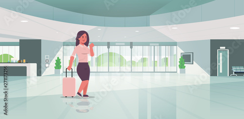 businesswoman with luggage modern reception area business woman holding suitcase girl standing in lobby contemporary hotel hall interior flat horizontal full length