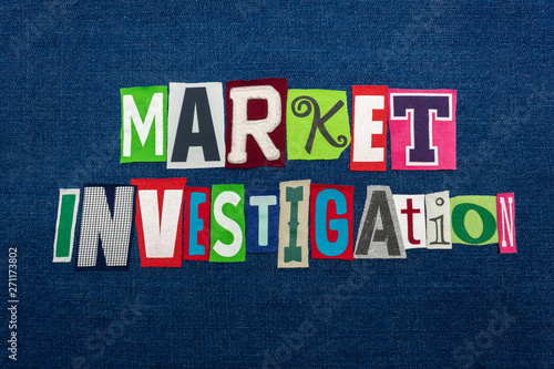 MARKET INVESTIGATION text word collage, multi colored fabric on blue denim, new markets concept, horizontal aspect