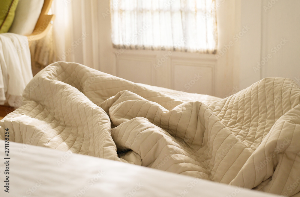 Crumpled blanket in bedroom,Brown color toned