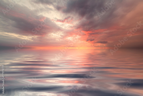 Colorful sea background wallpaper. Sunrise over the sea and beautiful cloudscape. Inspirational calm sea with sunset sky. Meditation ocean and sky background. Colorful horizon over the water. © Ivan
