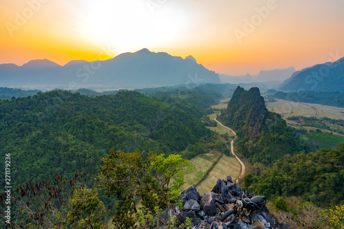 Top view of Beautiful Forest landscape of Sunset at pha Namxay Mountains Vang Vieng, Laos photo