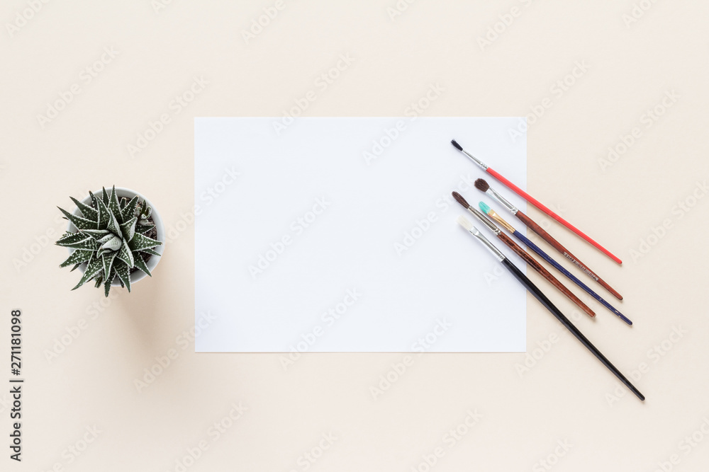 Naklejka premium brush paper cactus desktop view with copy space for your text. flat lay. ,